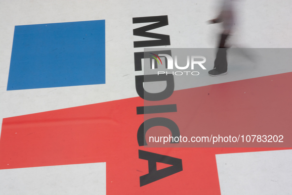 A trade fair attendee is walking past the Medica logo at the Medica Fair 2023 in Dusseldorf, Germany, on November 13, 2023. 