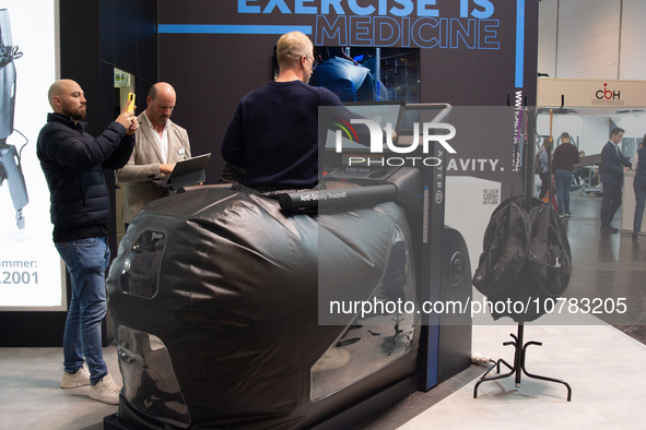 A trade fair attendee is testing an anti-gravity treadmill for pain-free physical rehabilitation training at the Medica Fair 2023 in Dusseld...