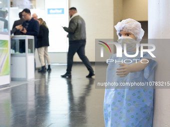 A mannequin wearing a protective mask is being displayed at the Medica Fair 2023 in Dusseldorf, Germany, on November 13, 2023. (