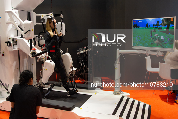 A trade fair attendee is testing an anti-gravity treadmill for pain-free physical rehabilitation training at the Medica Fair 2023 in Dusseld...