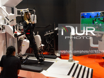 A trade fair attendee is testing an anti-gravity treadmill for pain-free physical rehabilitation training at the Medica Fair 2023 in Dusseld...