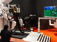 A trade fair attendee is testing an anti-gravity treadmill for pain-free physical rehabilitation training at the Medica Fair 2023 in Dusseld...