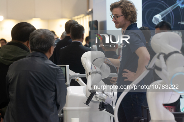 A vendor is demonstrating the robotic arm-assisted system at the Medica Fair 2023 in Dusseldorf, Germany, on November 13, 2023. 