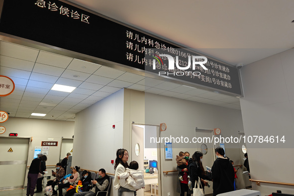 SHANGHAI, CHINA - NOVEMBER 14, 2023 - Parents take their children to see a doctor at the pediatric emergency department of a hospital in Sha...