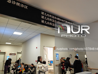 SHANGHAI, CHINA - NOVEMBER 14, 2023 - Parents take their children to see a doctor at the pediatric emergency department of a hospital in Sha...