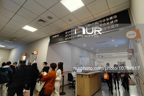 SHANGHAI, CHINA - NOVEMBER 14, 2023 - Parents take their children to see a doctor at the pediatric emergency department of a hospital in Sha...