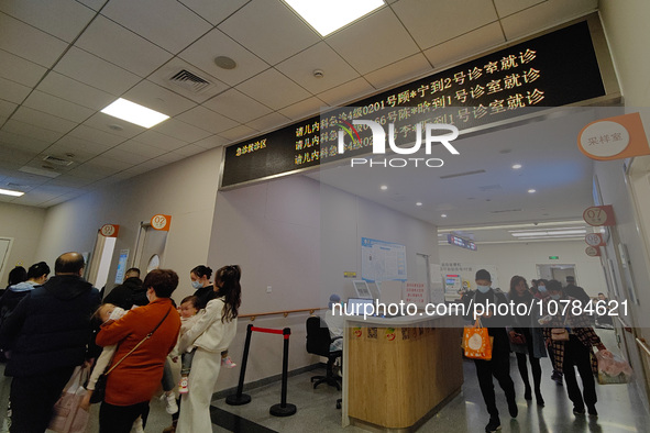 SHANGHAI, CHINA - NOVEMBER 14, 2023 - Parents take their children to see a doctor at the pediatric emergency department of a hospital in Sha...