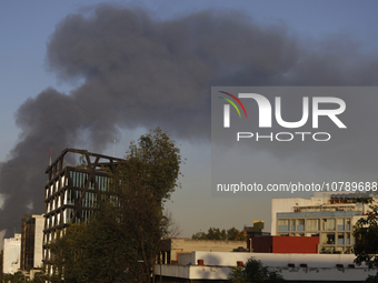 View of fire from Parque Lira in the shoe market in Tepito, Mexico City. (