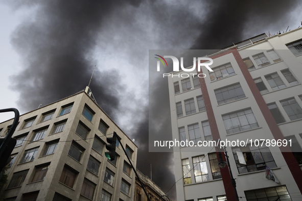 View of fire from the streets of the Historic Center of Mexico City, in the shoe market in Tepito. 