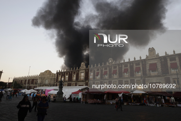 View of fire from the streets of the Historic Center of Mexico City, in the shoe market in Tepito. 