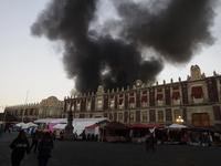 View of fire from the streets of the Historic Center of Mexico City, in the shoe market in Tepito. (