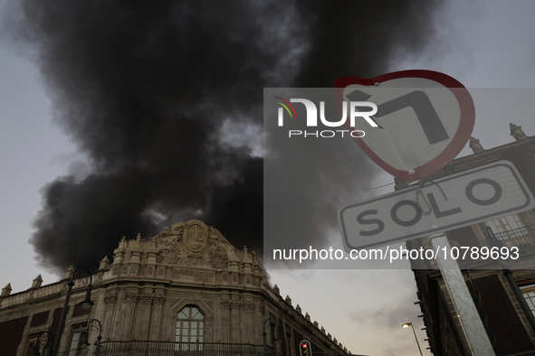 View of fire from the streets of the Historic Center of Mexico City, in the shoe market in Tepito. 