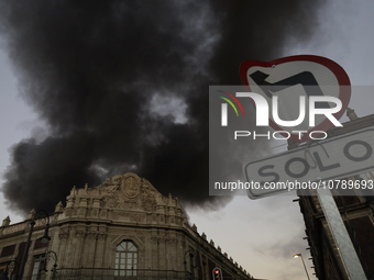 View of fire from the streets of the Historic Center of Mexico City, in the shoe market in Tepito. (