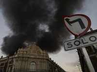 View of fire from the streets of the Historic Center of Mexico City, in the shoe market in Tepito. (