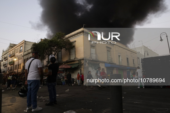 View of fire from the streets of the Historic Center of Mexico City, in the shoe market in Tepito. 