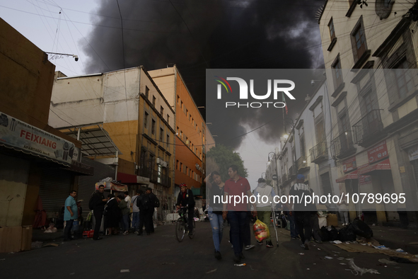 View of fire from the streets of the Historic Center of Mexico City, in the shoe market in Tepito. 