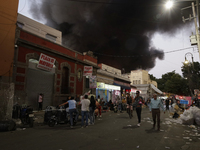 View of fire from the streets of the Historic Center of Mexico City, in the shoe market in Tepito. (