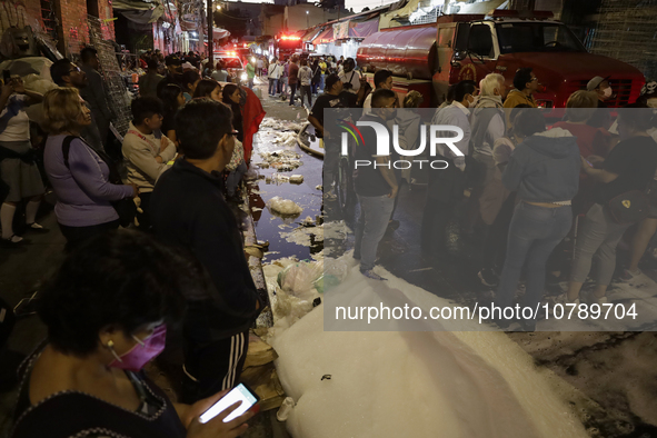 Merchants try to help firefighters after a fire in the shoe market in Tepito, Historic Center of Mexico City. 