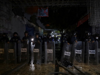 Police protect the area after a fire in the shoe market in Tepito, Historic Center of Mexico City. (