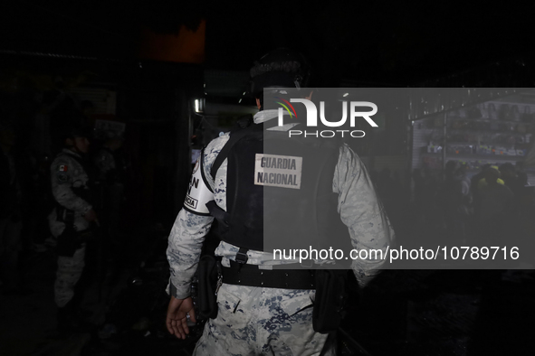 Police protect the area after a fire in the shoe market in Tepito, Historic Center of Mexico City. 