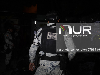 Police protect the area after a fire in the shoe market in Tepito, Historic Center of Mexico City. (