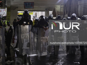 Police protect the area after a fire in the shoe market in Tepito, Historic Center of Mexico City. (