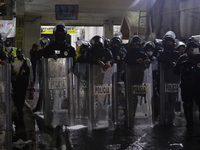 Police protect the area after a fire in the shoe market in Tepito, Historic Center of Mexico City. (