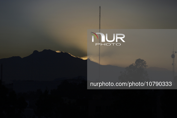 View of the Iztaccihuatl volcano from Mexico City at dawn. 