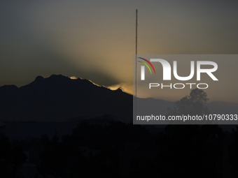 View of the Iztaccihuatl volcano from Mexico City at dawn. (