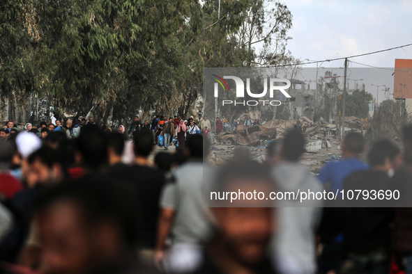 Palestinians fleeing Gaza City and other parts of northern Gaza, carry some belongings as they walk along a road leading to the southern are...