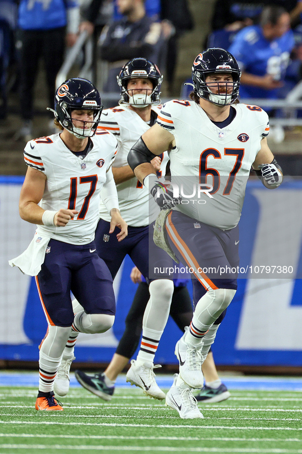 Chicago Bears quarterback Tyson Bagent (17) (L) and Chicago Bears guard Dan Feeney (67) (R) run onto the field prior to an NFL  football gam...