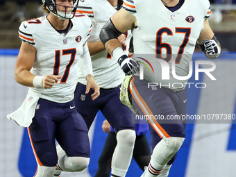 Chicago Bears quarterback Tyson Bagent (17) (L) and Chicago Bears guard Dan Feeney (67) (R) run onto the field prior to an NFL  football gam...