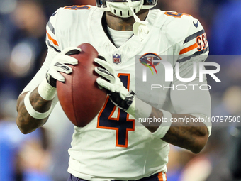 Chicago Bears safety Eddie Jackson (4) looks to throw ball down the field ahead of an NFL  football game between the Detroit Lions and the C...