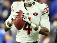 Chicago Bears safety Eddie Jackson (4) looks to throw ball down the field ahead of an NFL  football game between the Detroit Lions and the C...