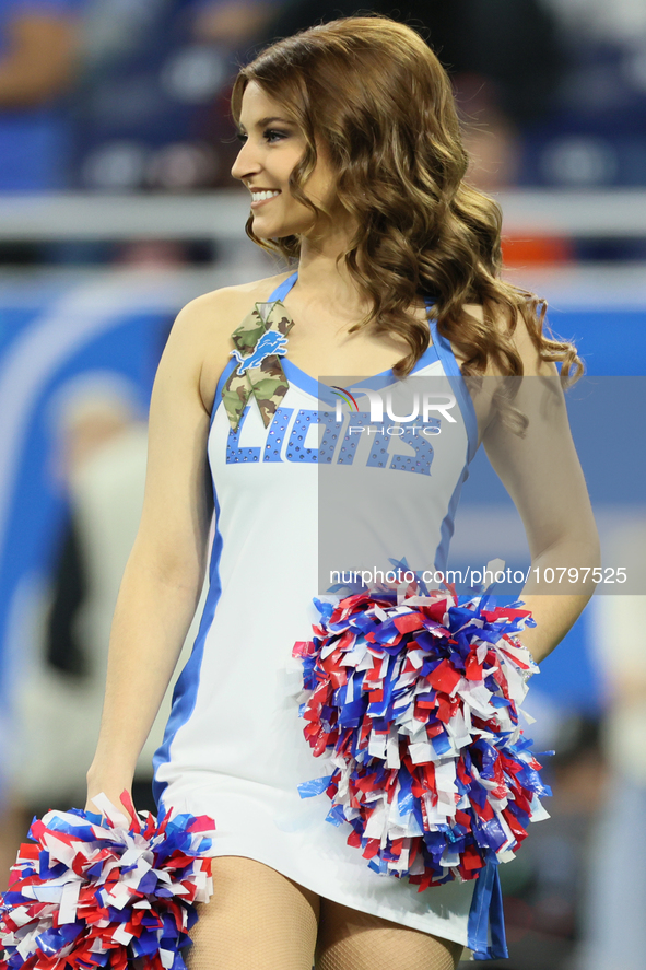 A member of the Detroit Lions cheer squad waits to welcome Lions players to the field ahead of an NFL  football game between the Detroit Lio...