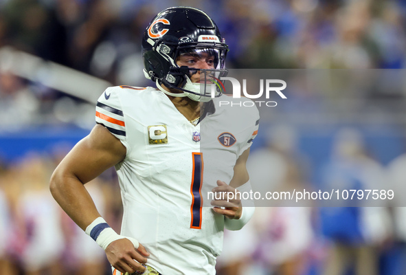 Chicago Bears quarterback Justin Fields (1) runs onto the field ahead of an NFL  football game between the Detroit Lions and the Chicago Bea...