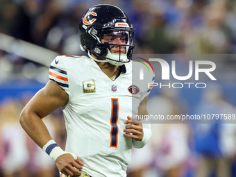 Chicago Bears quarterback Justin Fields (1) runs onto the field ahead of an NFL  football game between the Detroit Lions and the Chicago Bea...