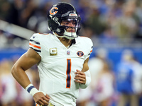 Chicago Bears quarterback Justin Fields (1) runs onto the field ahead of an NFL  football game between the Detroit Lions and the Chicago Bea...