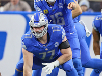 Detroit Lions quarterback Jared Goff (16) calls a play as Detroit Lions center Frank Ragnow (77) prepares to snap the ball during  an NFL  f...