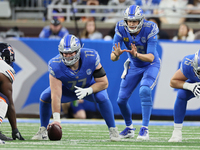 Detroit Lions quarterback Jared Goff (16) prepares to catch a snap from Detroit Lions center Frank Ragnow (77) during  an NFL  football game...