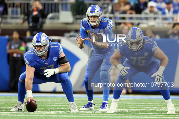 Detroit Lions quarterback Jared Goff (16) prepares to catch the snap from Detroit Lions center Frank Ragnow (77) during  an NFL football gam...