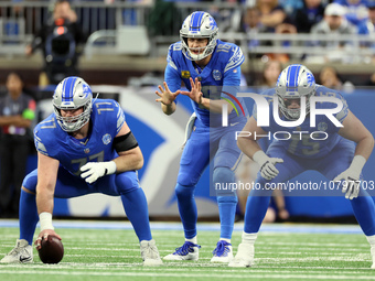 Detroit Lions quarterback Jared Goff (16) prepares to catch the snap from Detroit Lions center Frank Ragnow (77) during  an NFL football gam...