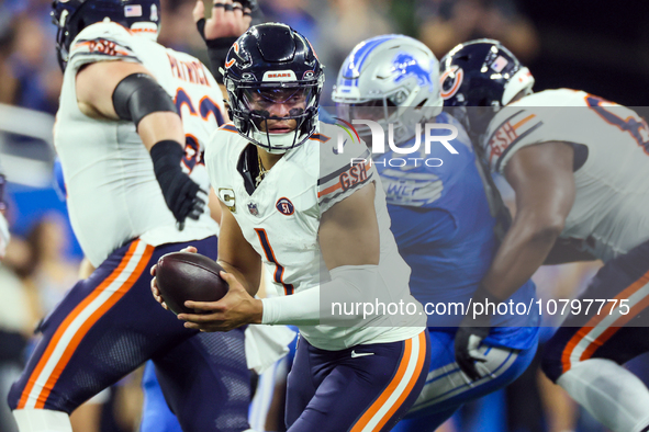 Chicago Bears quarterback Justin Fields (1) looks to pass the ball during  an NFL  football game between the Detroit Lions and the Chicago B...