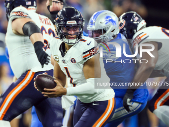 Chicago Bears quarterback Justin Fields (1) looks to pass the ball during  an NFL  football game between the Detroit Lions and the Chicago B...