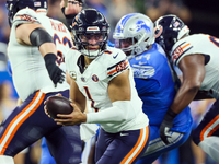 Chicago Bears quarterback Justin Fields (1) looks to pass the ball during  an NFL  football game between the Detroit Lions and the Chicago B...