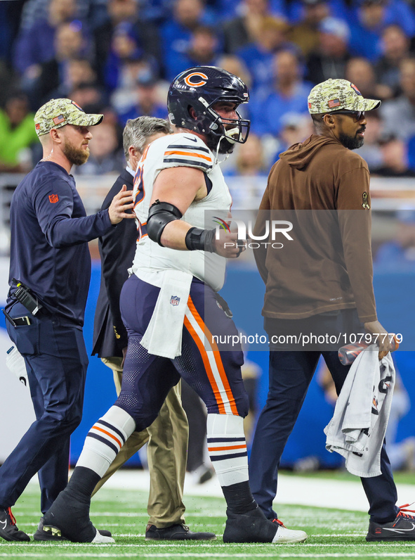 Chicago Bears guard Lucas Patrick (62) is assisted off the field after being checked for an injury during  an NFL  football game between the...