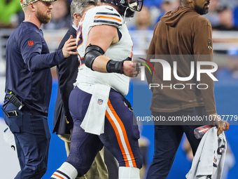 Chicago Bears guard Lucas Patrick (62) is assisted off the field after being checked for an injury during  an NFL  football game between the...