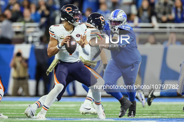 Chicago Bears quarterback Justin Fields (1) looks to pass the ball during  an NFL  football game between the Detroit Lions and the Chicago B...