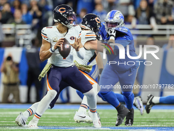 Chicago Bears quarterback Justin Fields (1) looks to pass the ball during  an NFL  football game between the Detroit Lions and the Chicago B...