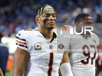 Chicago Bears quarterback Justin Fields (1) walks off the field after the conclusion of an NFL football game between the Chicago Bears and t...